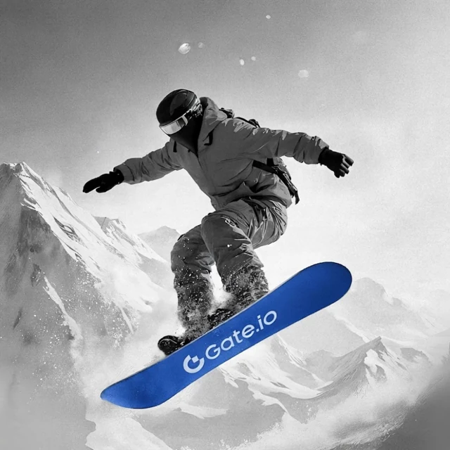 A snowboarder in monochrome with a blue Gate.io snowboard.