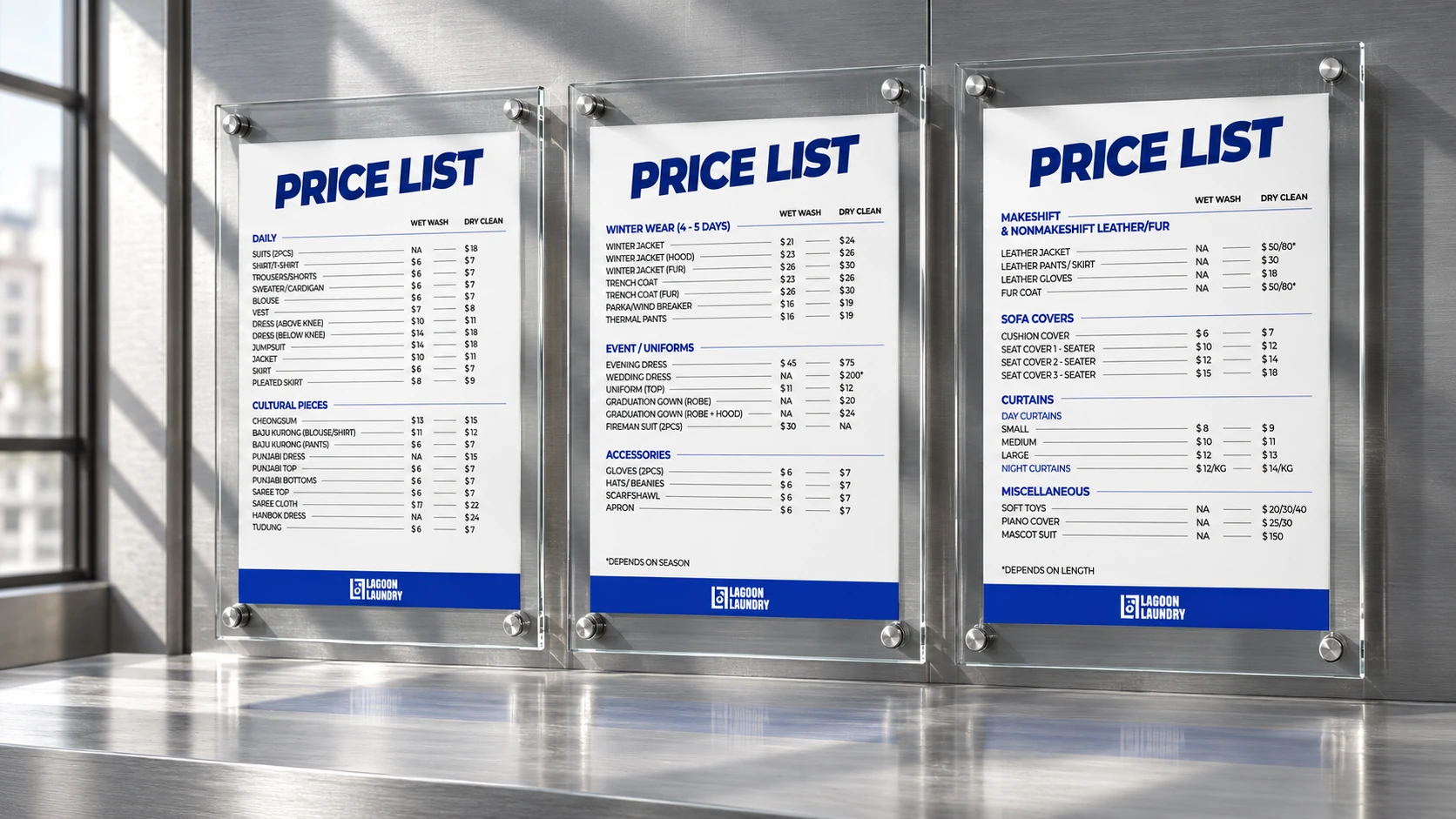 Three Lagoon Laundry service price lists displayed in glass panels under strong natural light.