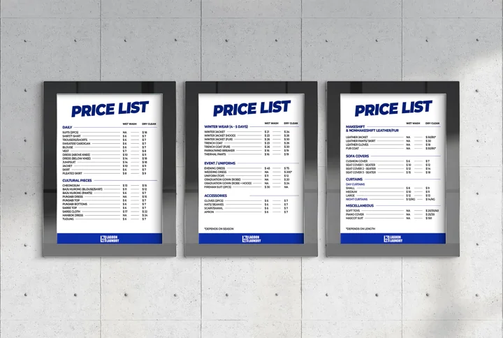 Three framed Lagoon Laundry service price lists.